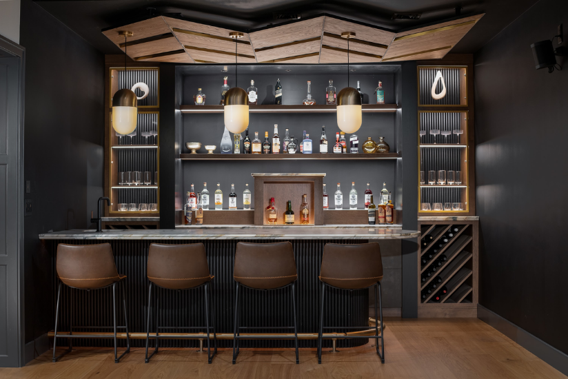 Custom bar with fluted cabinetry and open shelving