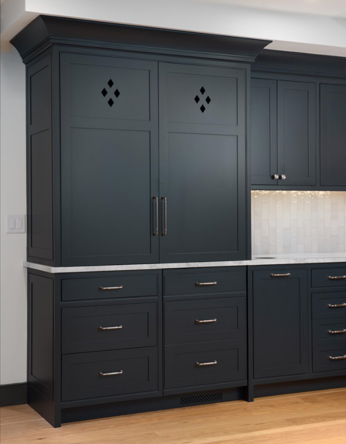 Navy coffee bar cabinetry, doors closed