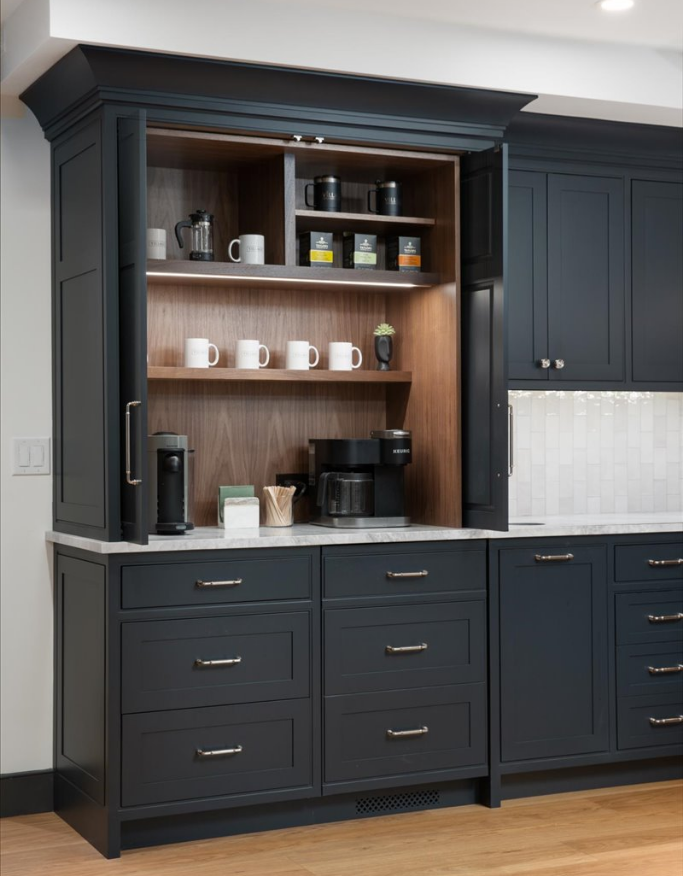 Navy coffee bar cabinetry, appliance garage open